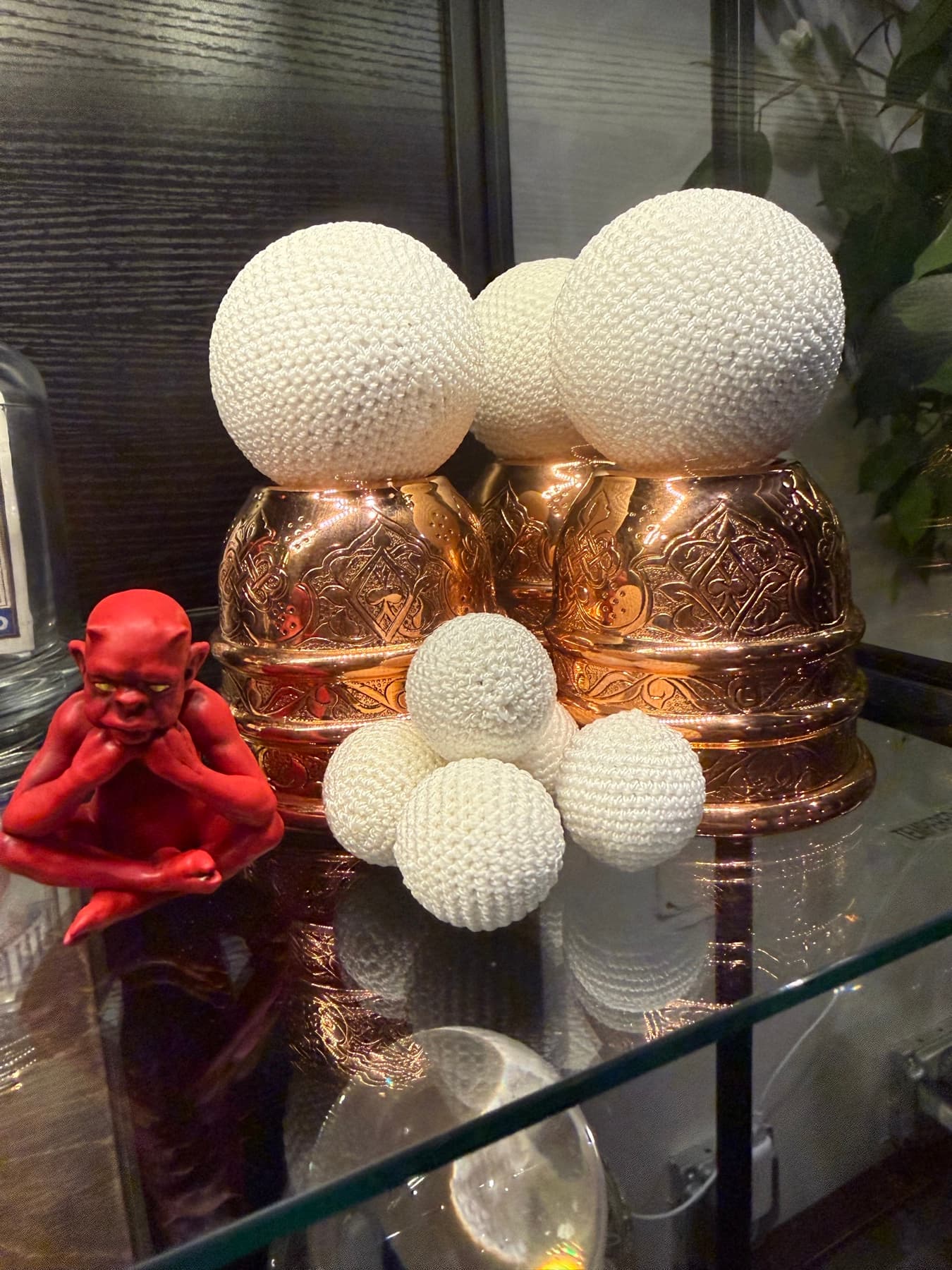 A detail from inside the parlour — curios glowing under glass